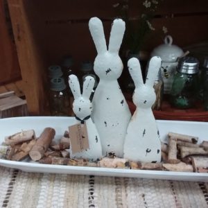 White chippy bunnies in a display with wood chunks on platter-Olde Crow Gatherings