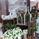 Farmhouse display with wooden candle holders, barn picture, florals - Olde Crow Gatherings